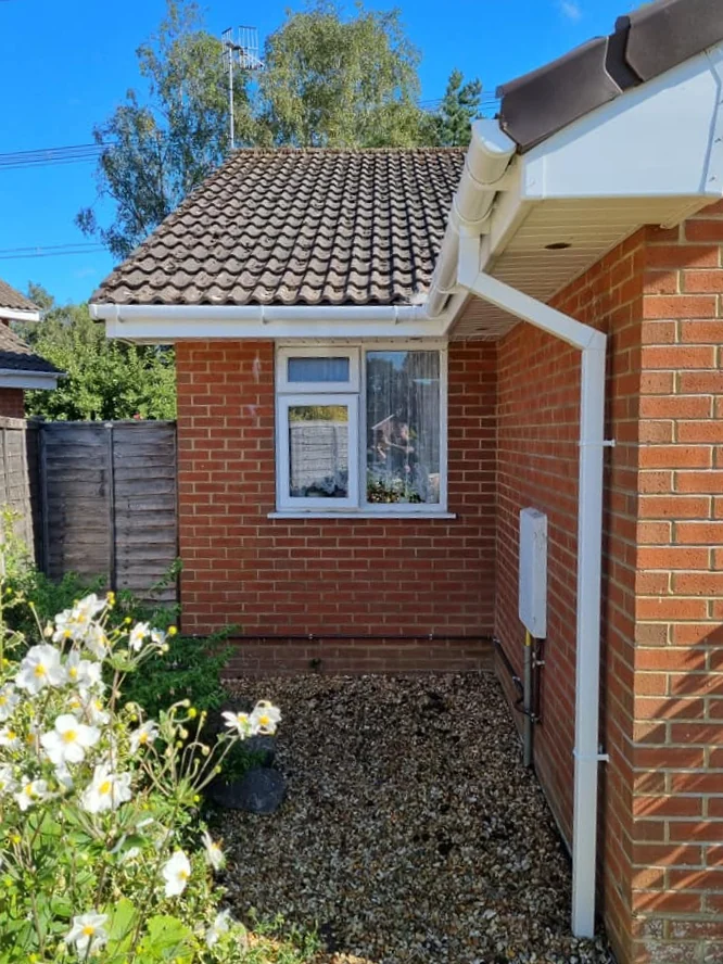New guttering fitted along a roofline on a property in Poole by Apex Roofing Services